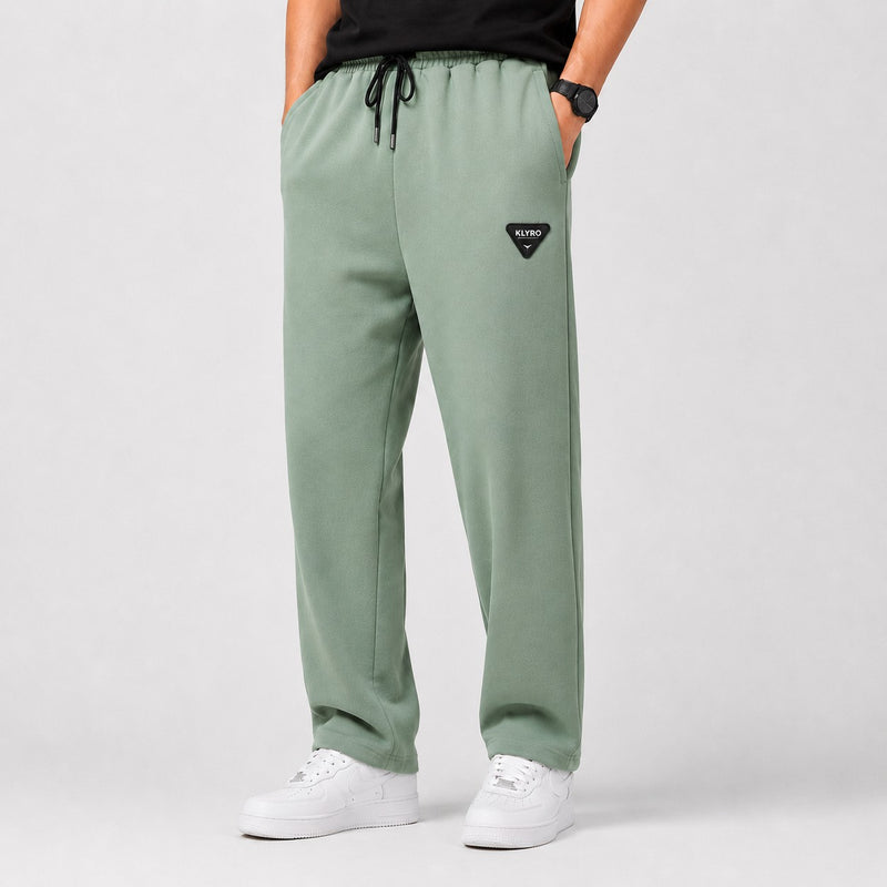 KLYRO FASHION men's sage green casual track pants with drawstring waist, side pockets, and a signature brand patch.